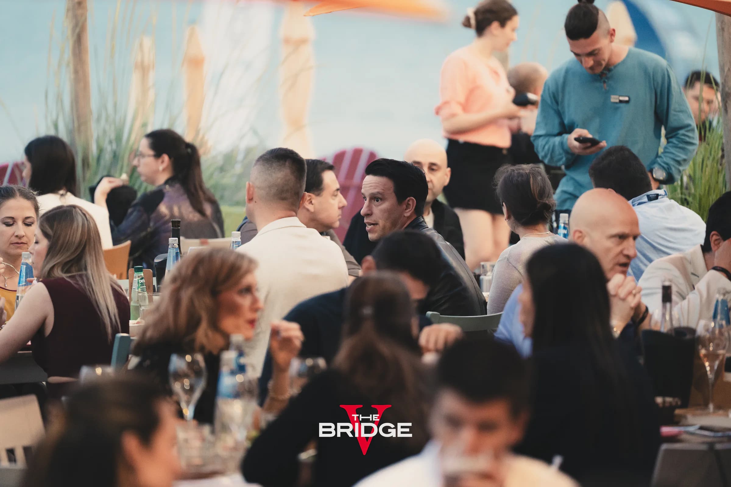 Informal moments and connections at The Bridge seaside gathering.